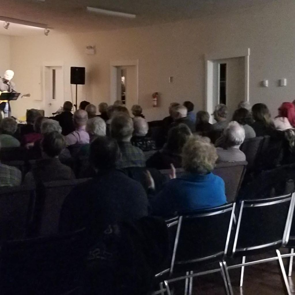 Bible-focused ministry moment with congregation listening attentively